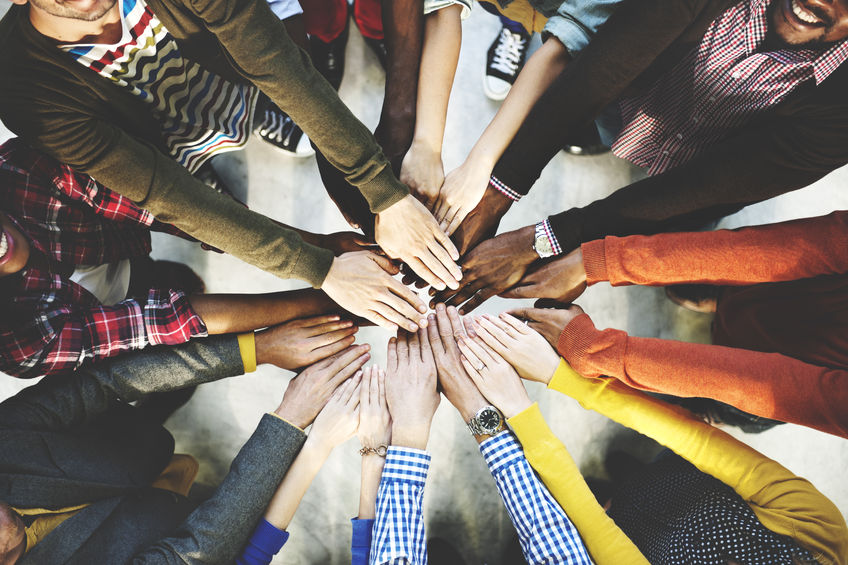 52414187 – group of diverse hands together joining concept