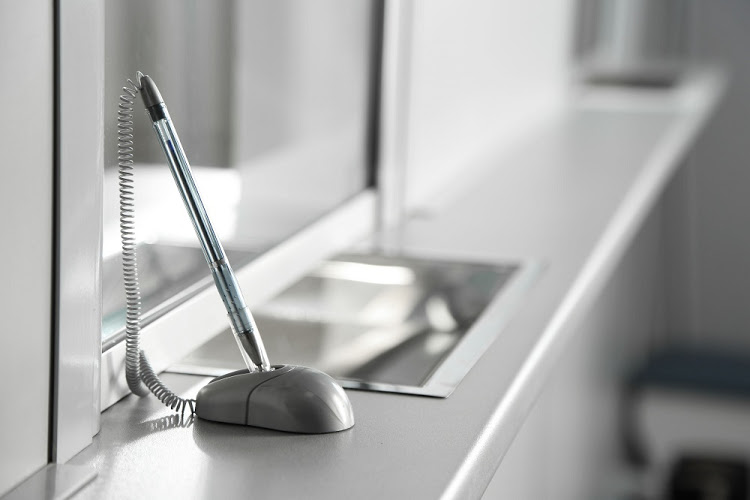 40731913 – pen on surface near cash department window